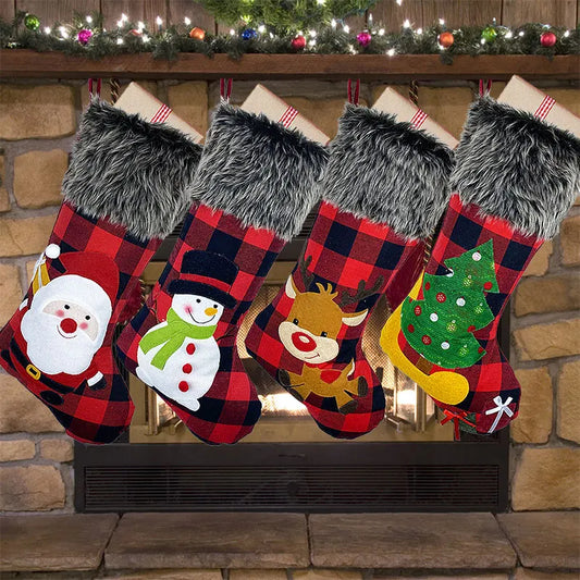 Four Christmas stockings with festive designs hanging above a fireplace.