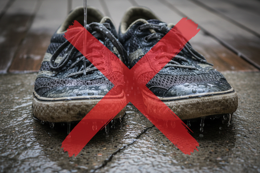 wet shoes standing on the grown crossed