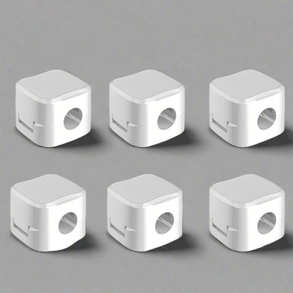 Set of 6 white cable clip holders organizing and securing charging cables on desk for clutter-free workspace