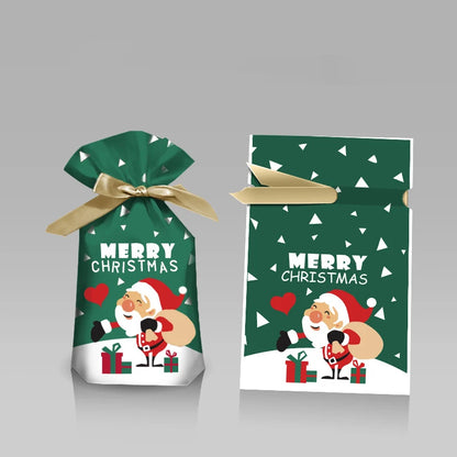 Two green Christmas gift bags with Santa Claus design on a gray background