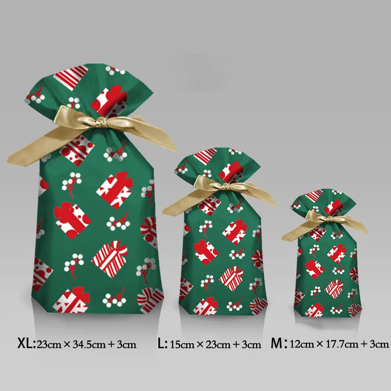 Set of three green gift bags with red and white patterns and gold ribbons on a gray background.