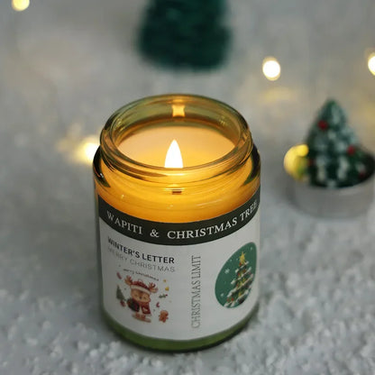 Candle in a jar labeled 'Wapiti & Christmas Tree' with festive decorations in the background.