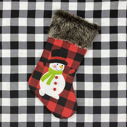 Red and black checkered Christmas stocking with a snowman design on a black and white checkered background.