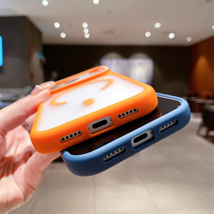 Two phone cases, one orange and one blue, held by a hand with a blurred indoor background.