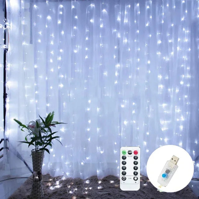 String lights with remote control and USB adapter on a white curtain background