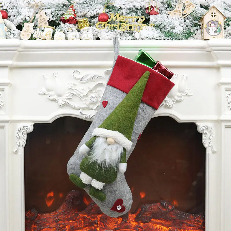 Christmas stocking with a gnome design hanging over a fireplace.