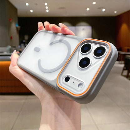 Hand holding a phone case with a modern design in an indoor setting