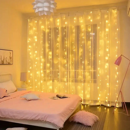 Bedroom with fairy lights draped over a window, creating a warm and cozy atmosphere.