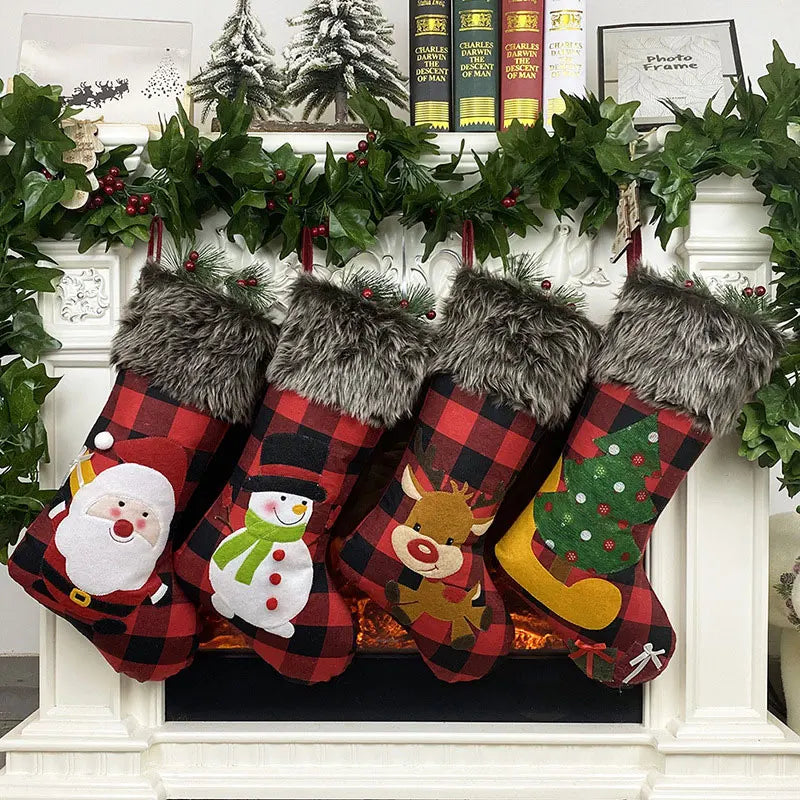 Four Christmas stockings with festive designs on a decorated fireplace.