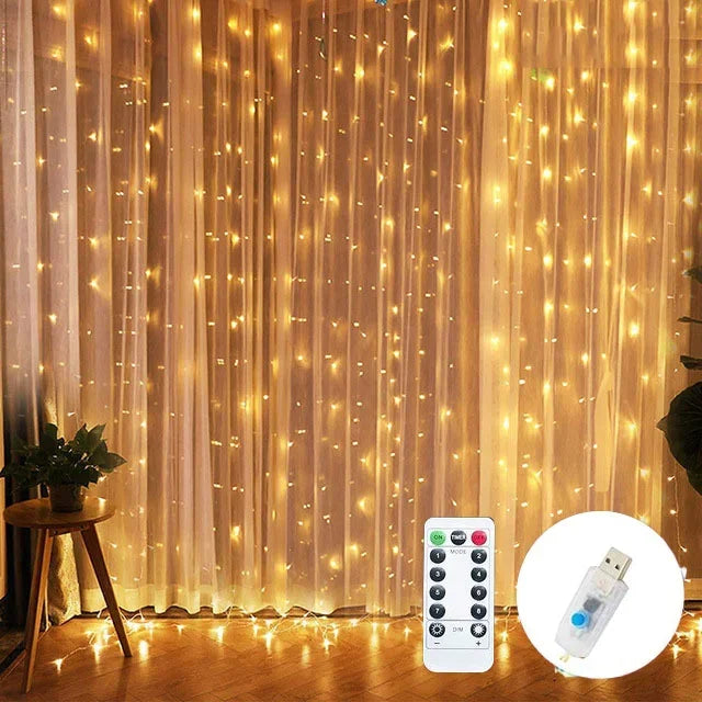 String lights with remote control and USB adapter on a curtain background