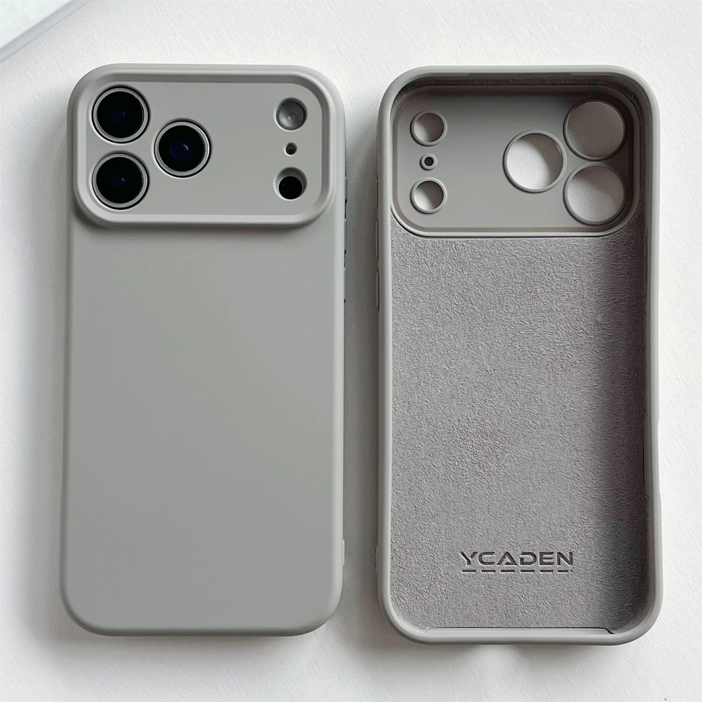 Two phone cases, one plain and one with 'YCAIDEN' branding, on a white background.