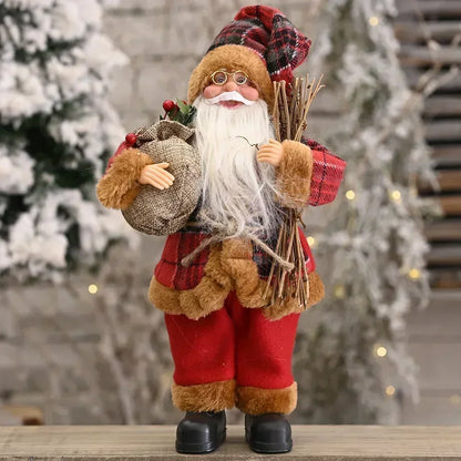 Decorative Santa Claus figure holding a bag and branches against a Christmas tree background
