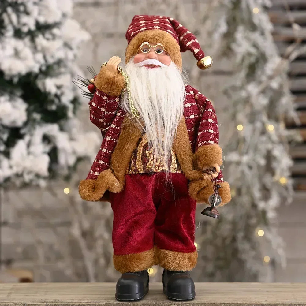 Decorative Santa Claus figure with a plaid hat and coat, standing on a wooden surface with a blurred Christmas tree background.
