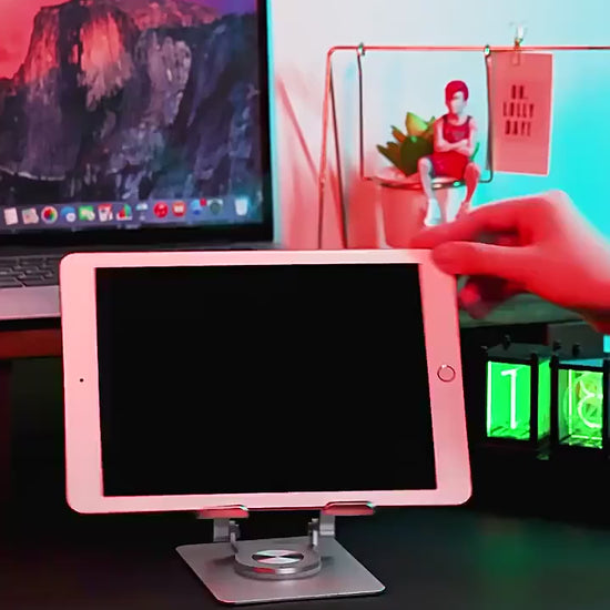 Rotating stand holder for tablets and phones, allowing for flexible viewing angles and easy adjustments.