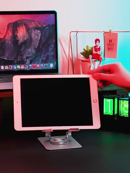 Rotating stand holder for tablets and phones, allowing for flexible viewing angles and easy adjustments.